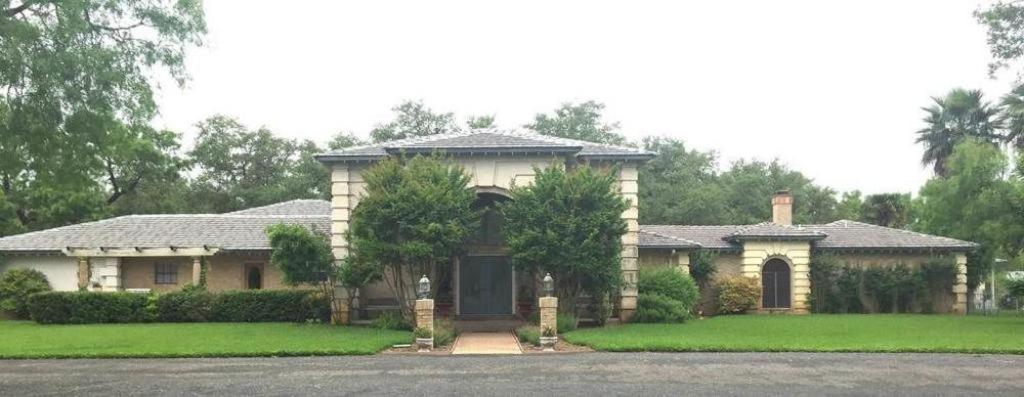 a large house with a driveway in front of it at Live Oaks Bed and Breakfast in Uvalde