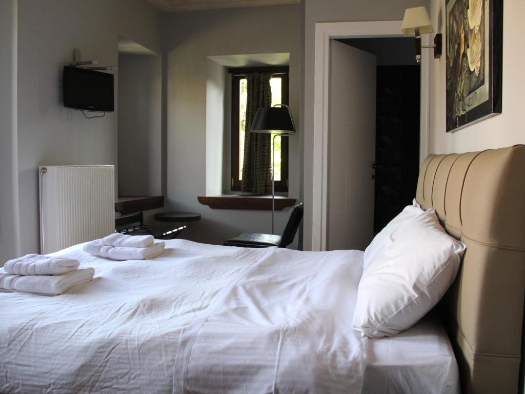 Postel nebo postele na pokoji v ubytování Tsarbou Guesthouse