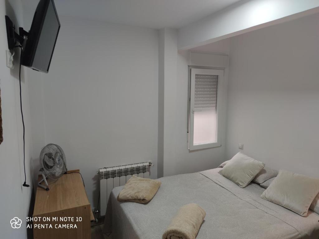 A bed or beds in a room at Habitación AP