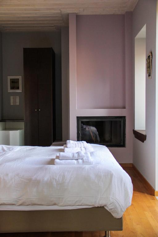 Postel nebo postele na pokoji v ubytování Tsarbou Guesthouse