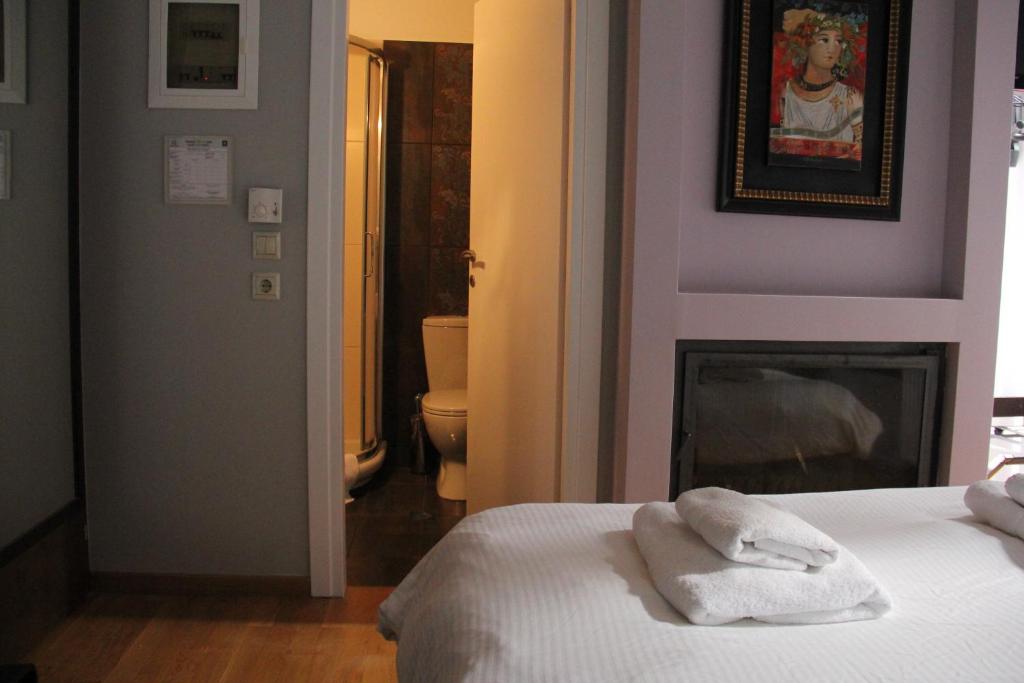 Postel nebo postele na pokoji v ubytování Tsarbou Guesthouse