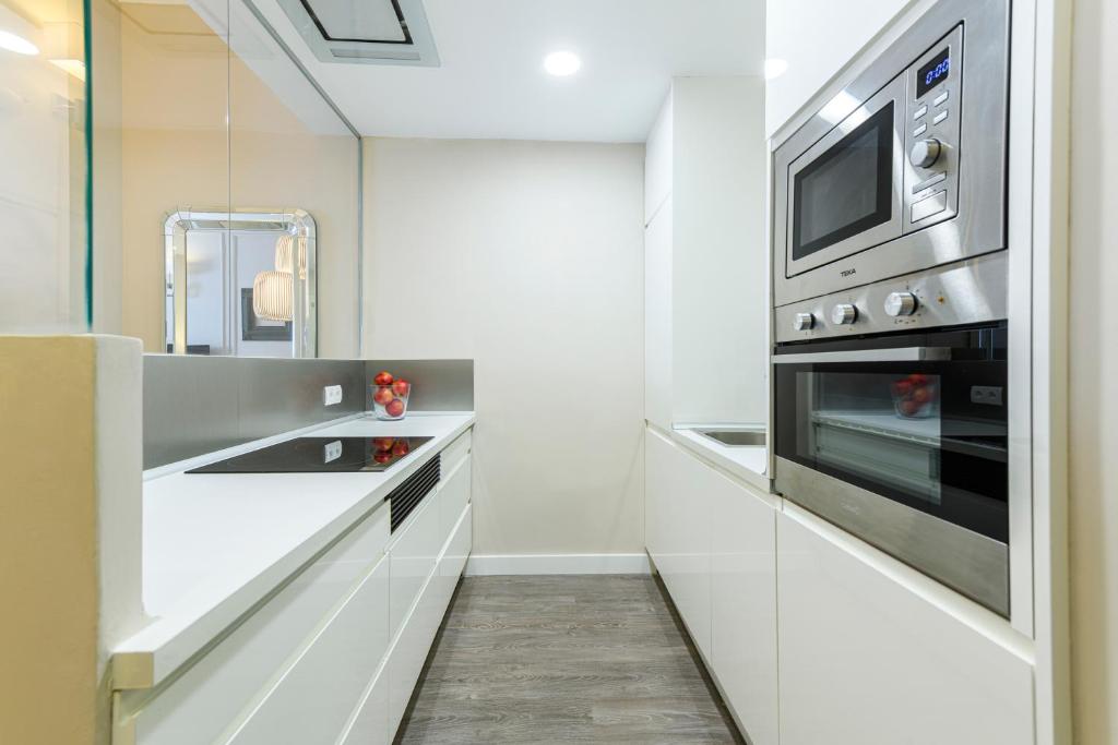 A kitchen or kitchenette at MD Pelayo