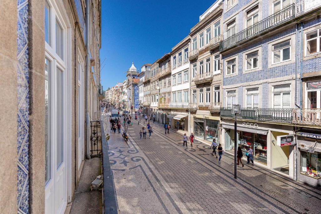 a view of a street with people walking down the street at YOUROPO - Stories in Porto