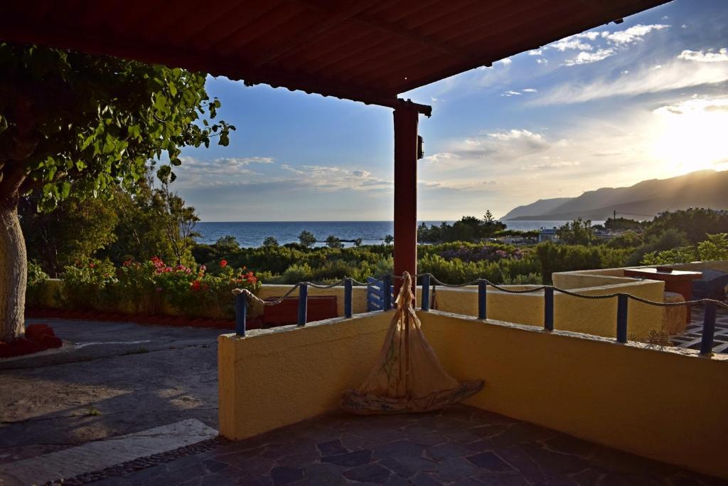 a balcony with a view of the ocean at Vrachos Apartments in Frangokastello