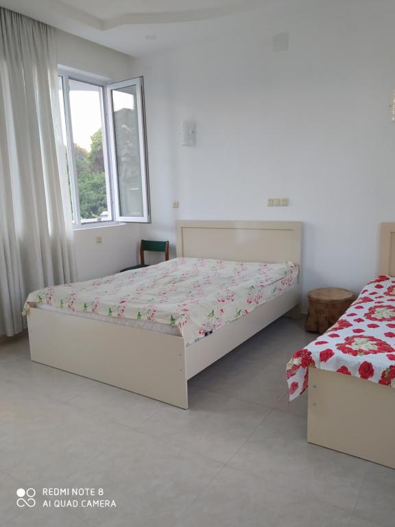 Postel nebo postele na pokoji v ubytování Emzari's Apartment