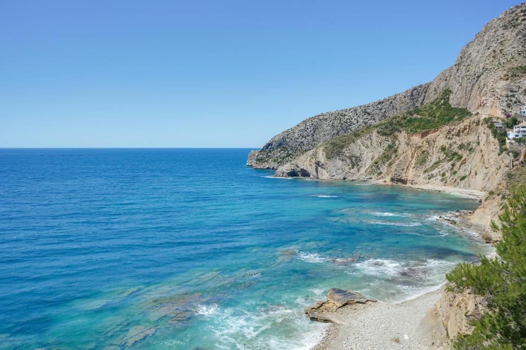a view of the ocean from a cliff at Maryvilla Inspiración y Vacaciones - Bungalows in Calpe
