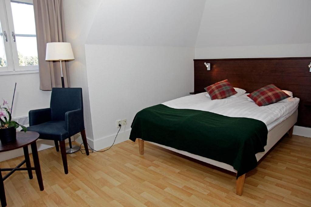Postel nebo postele na pokoji v ubytování Rasta Kalmar