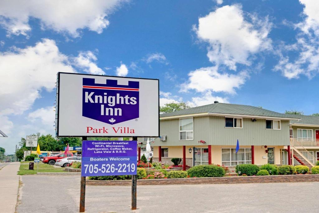 a sign for a kiths inn park village at Knights Inn - Park Villa Motel, Midland in Midland