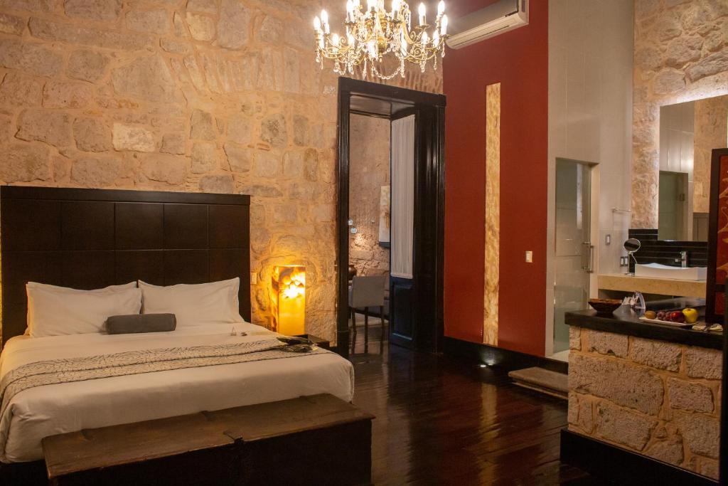 Postel nebo postele na pokoji v ubytování Cantera 10 Hotel Boutique