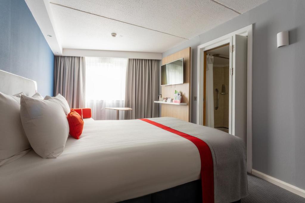 Postel nebo postele na pokoji v ubytování Holiday Inn Express - Glasgow - City Ctr Theatreland by IHG