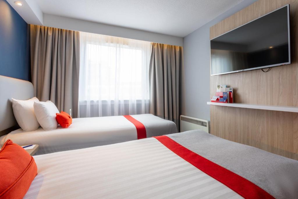 Postel nebo postele na pokoji v ubytování Holiday Inn Express - Glasgow - City Ctr Theatreland by IHG