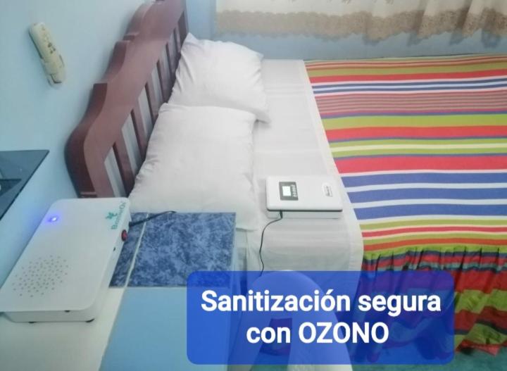 Postel nebo postele na pokoji v ubytování Hostal Aruba