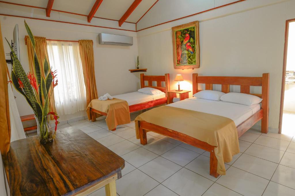 Postel nebo postele na pokoji v ubytování Hotel Cerro Lodge