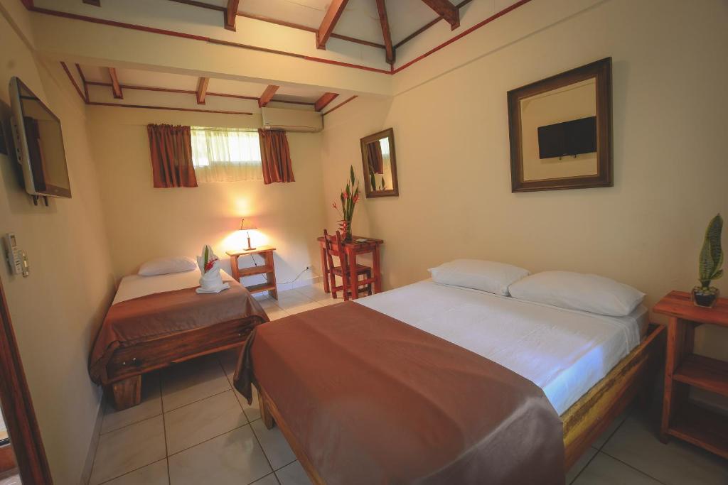 Postel nebo postele na pokoji v ubytování Hotel Cerro Lodge