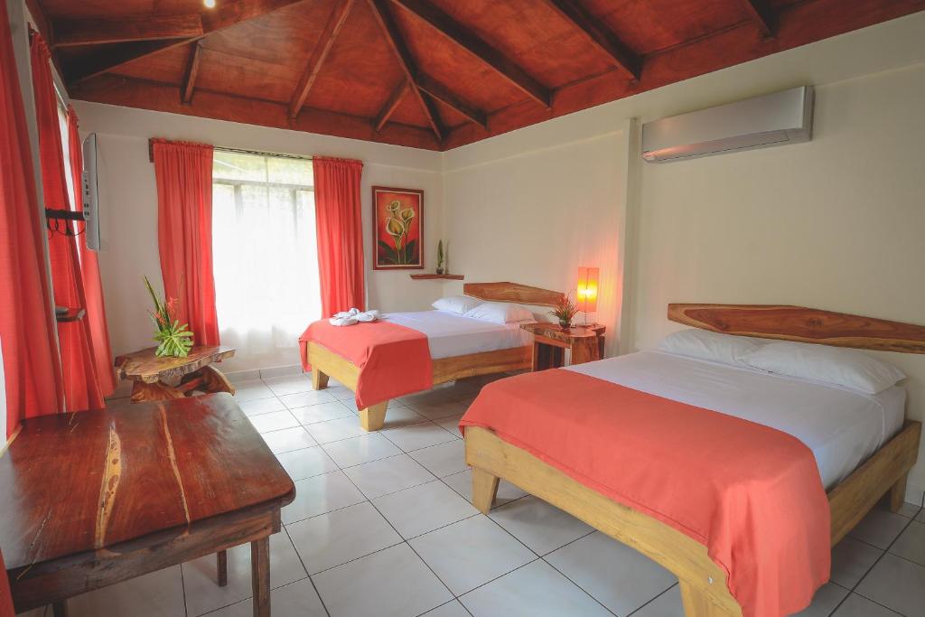 Postel nebo postele na pokoji v ubytování Hotel Cerro Lodge