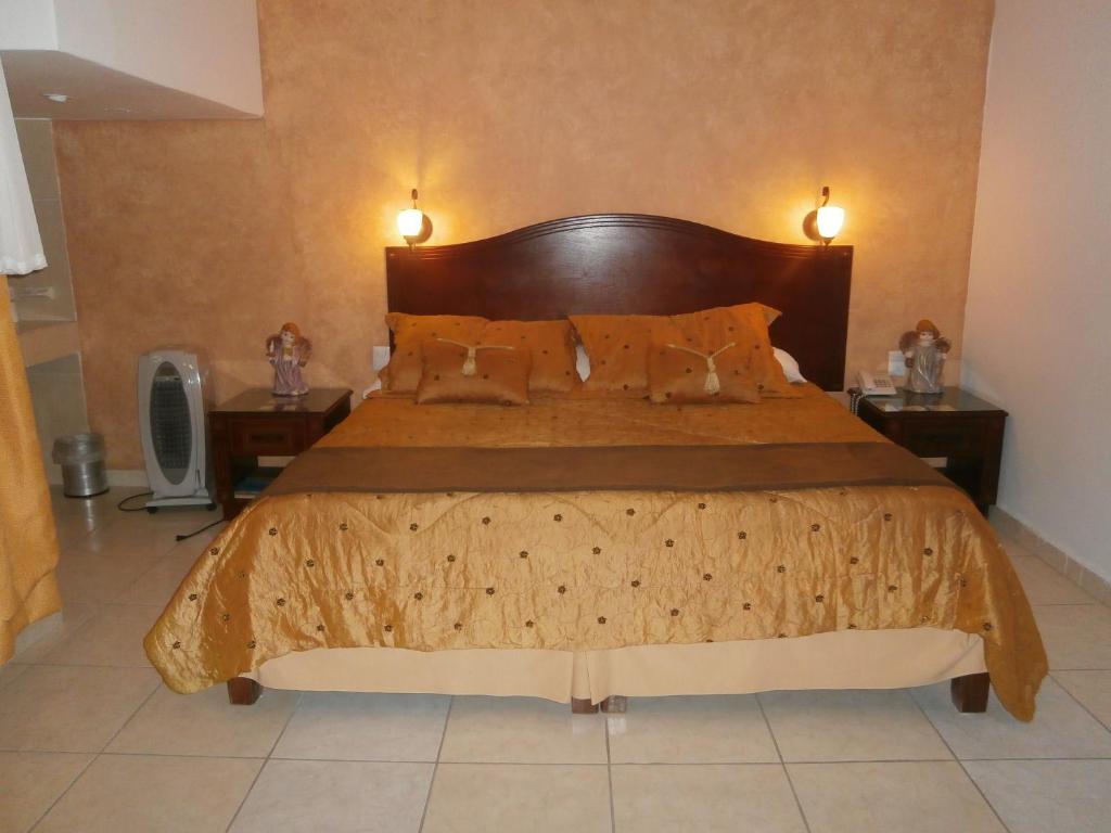Postel nebo postele na pokoji v ubytování Hotel Anber
