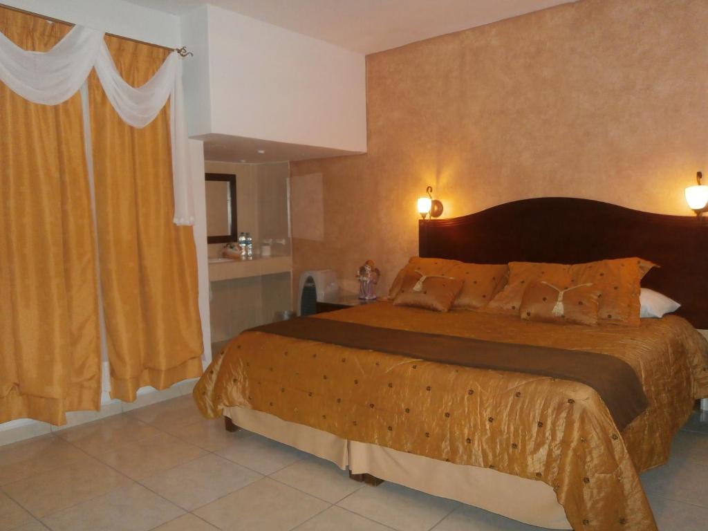 Postel nebo postele na pokoji v ubytování Hotel Anber