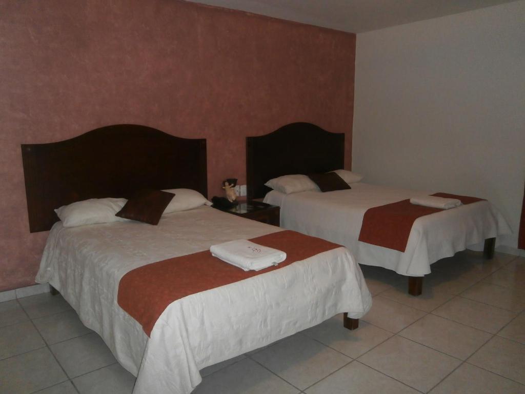 Postel nebo postele na pokoji v ubytování Hotel Anber