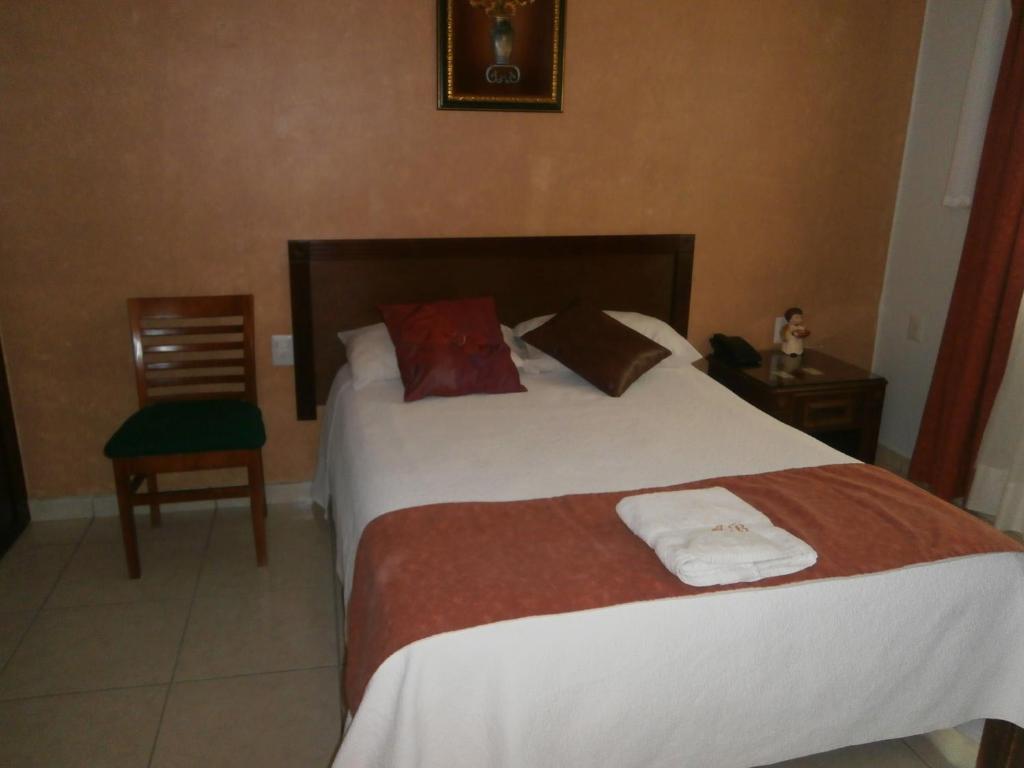 Postel nebo postele na pokoji v ubytování Hotel Anber