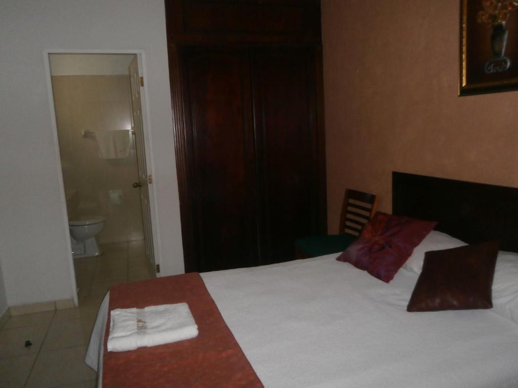 Postel nebo postele na pokoji v ubytování Hotel Anber