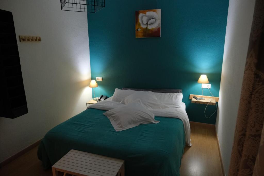 Postel nebo postele na pokoji v ubytování Hotel Arbre De Neu