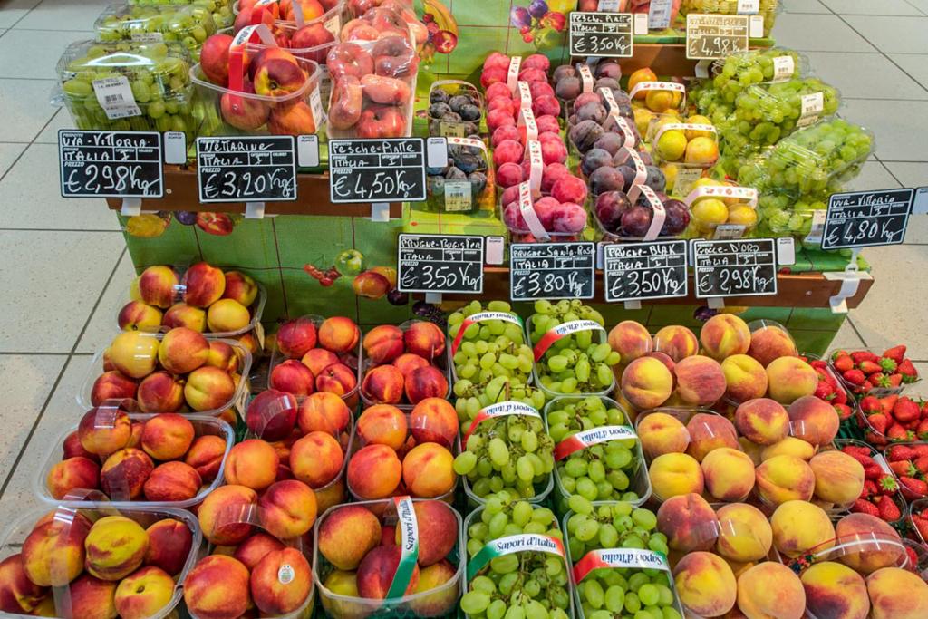 a display of fruits and vegetables in a store at Portofelice Camping Village in Eraclea Mare