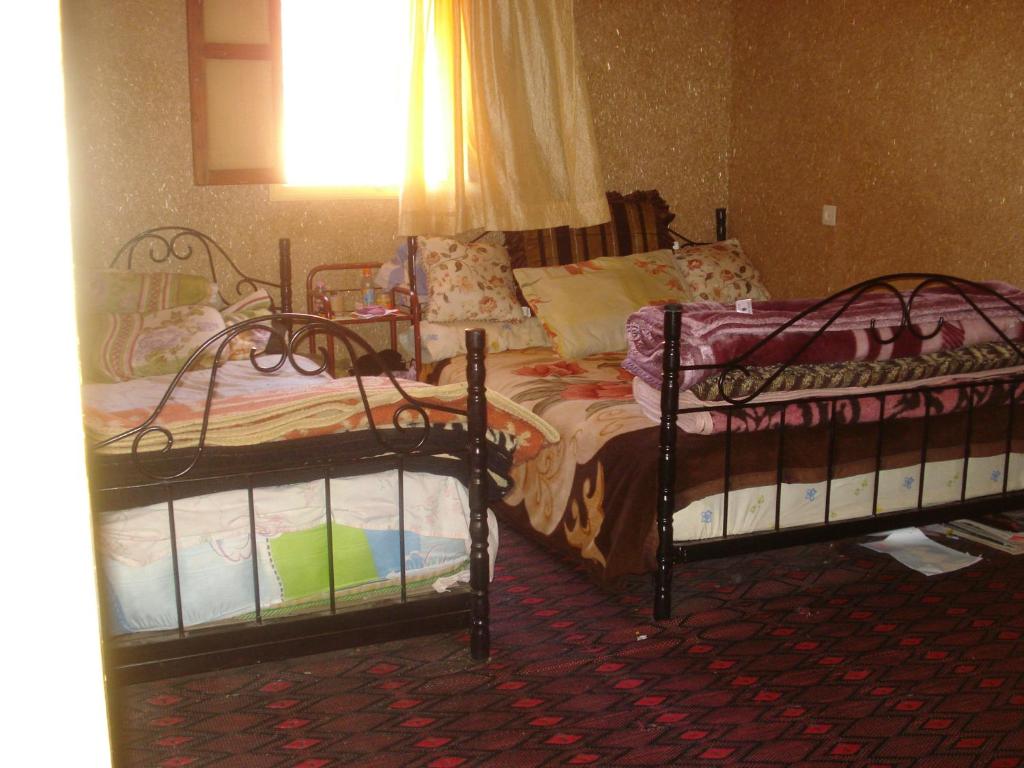 Postel nebo postele na pokoji v ubytování Auberge Gitelkst