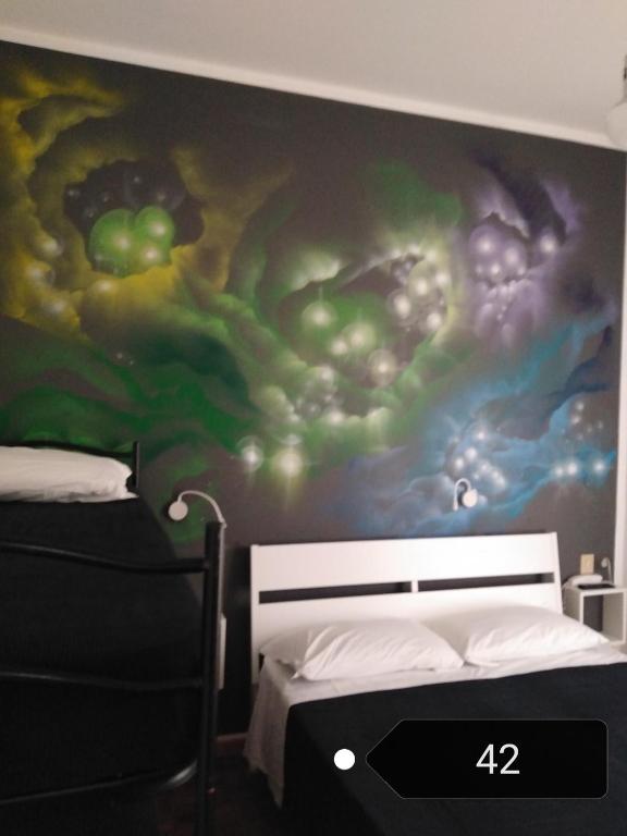 Postel nebo postele na pokoji v ubytování X Hotel