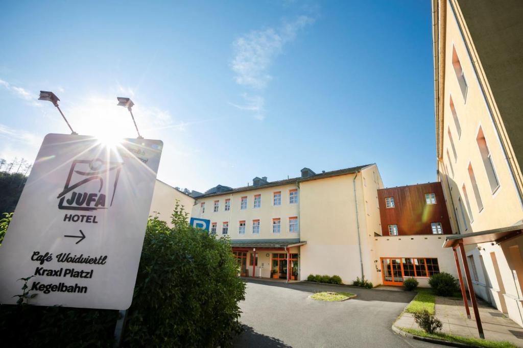 a sign for a hotel in front of a building at JUFA Hotel Waldviertel in Raabs an der Thaya