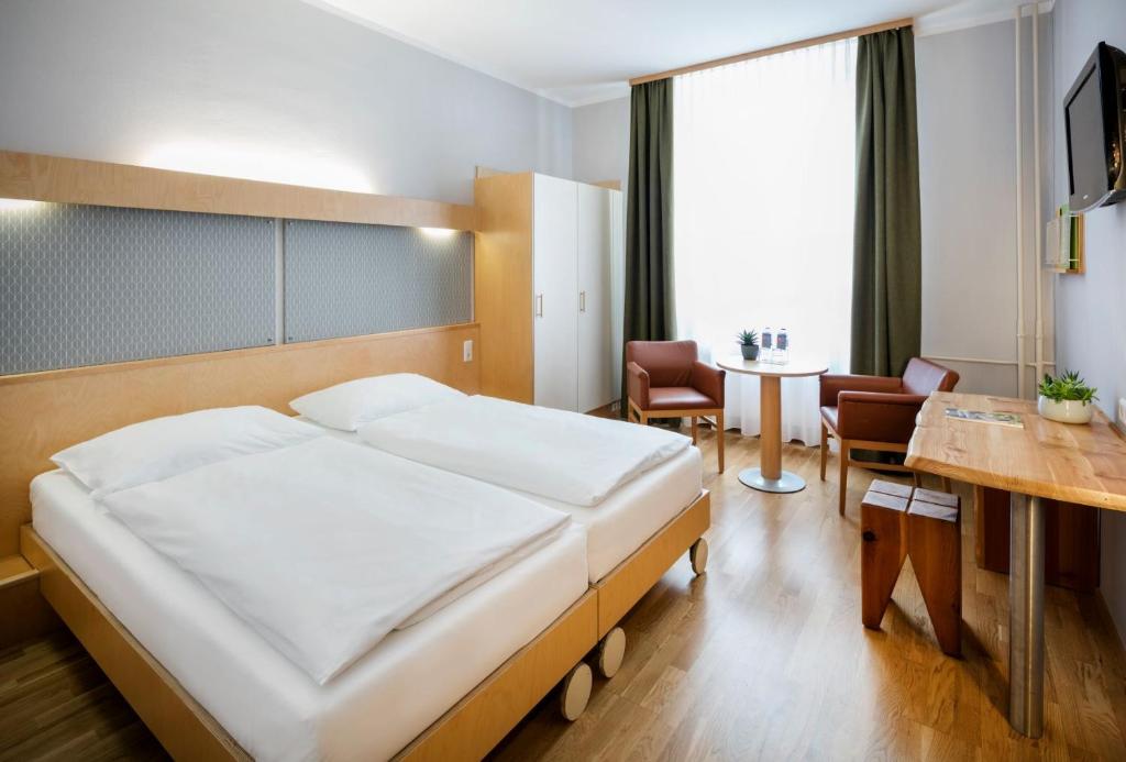 Postel nebo postele na pokoji v ubytování JUFA Hotel Waldviertel