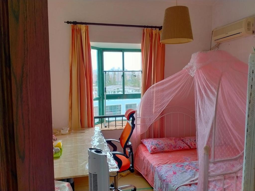 Postel nebo postele na pokoji v ubytování Yi Ju Homestay-ZhuanQiao Subway Station, MinHang District