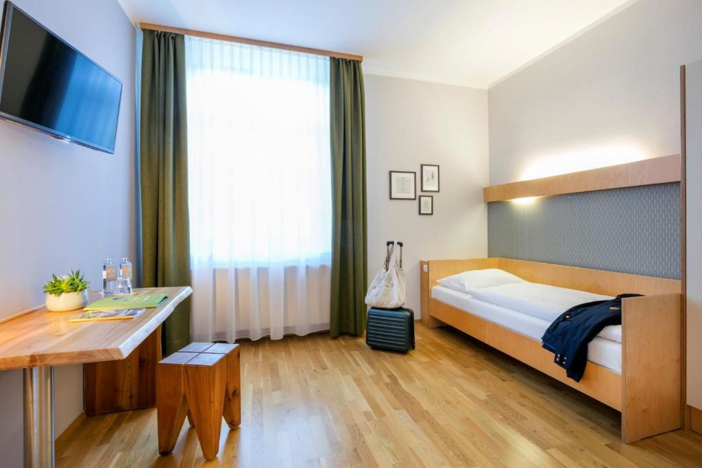 Postel nebo postele na pokoji v ubytování JUFA Hotel Waldviertel