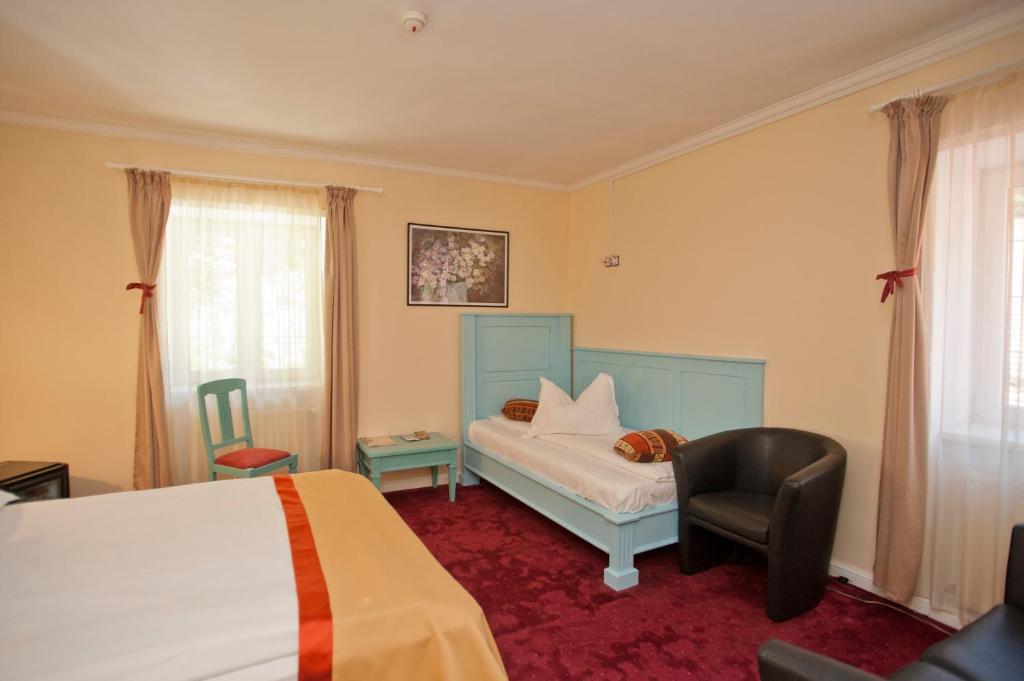 Postel nebo postele na pokoji v ubytování Hotel Bastion
