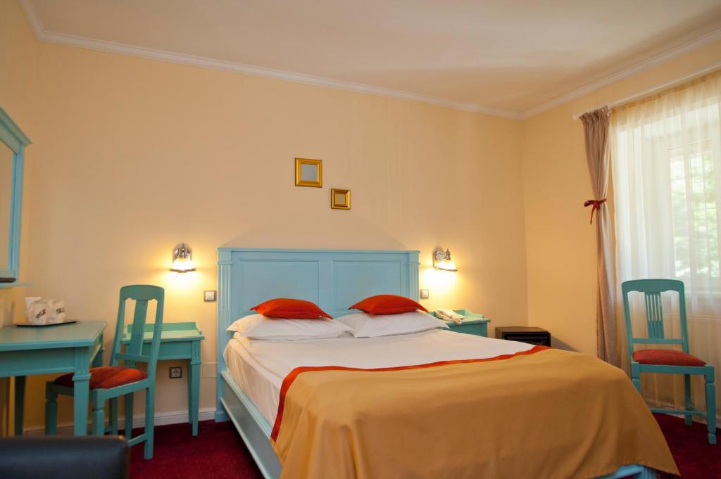 Postel nebo postele na pokoji v ubytování Hotel Bastion