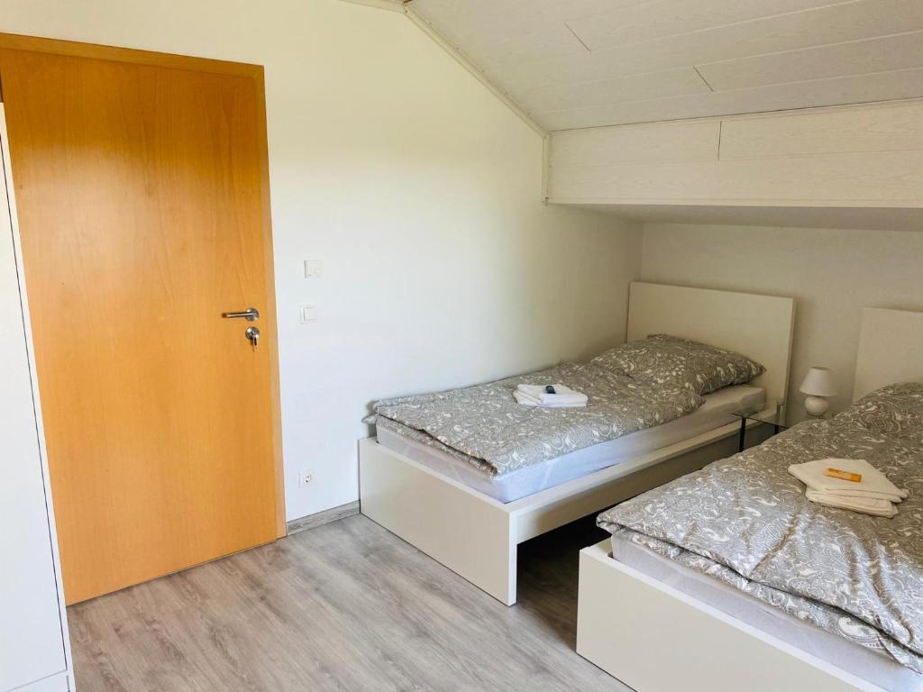 Postel nebo postele na pokoji v ubytování Pension Platzhirsch