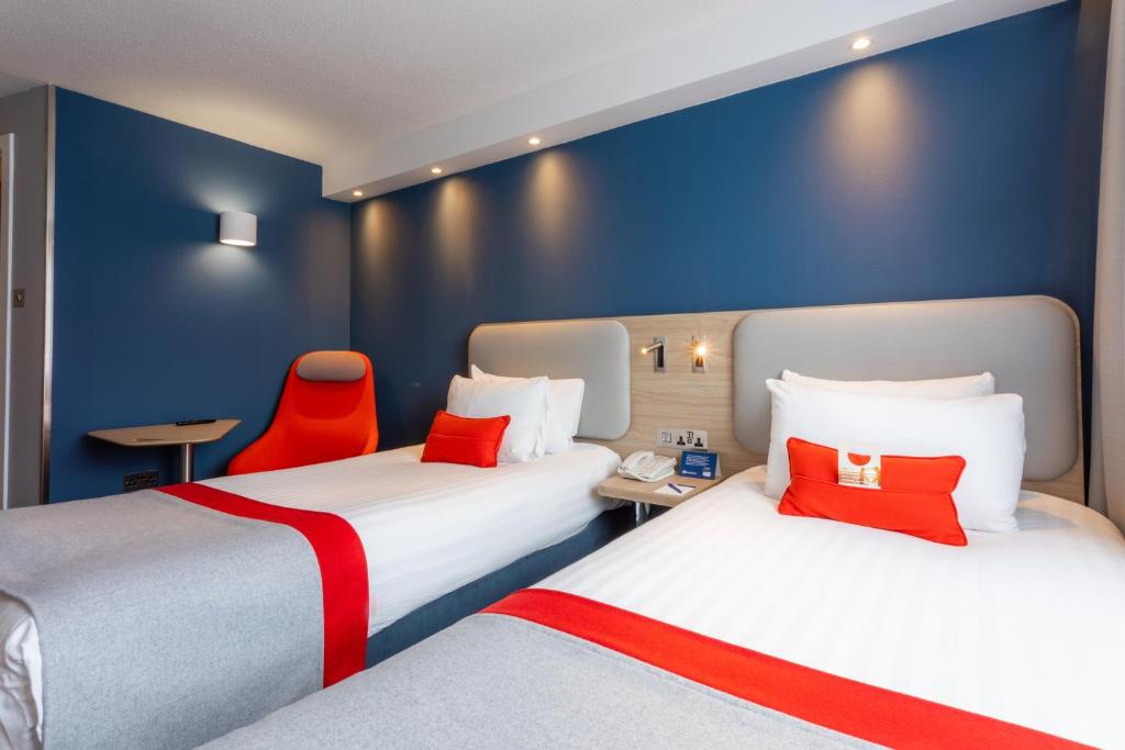 Postel nebo postele na pokoji v ubytování Holiday Inn Express - Glasgow - City Ctr Theatreland by IHG
