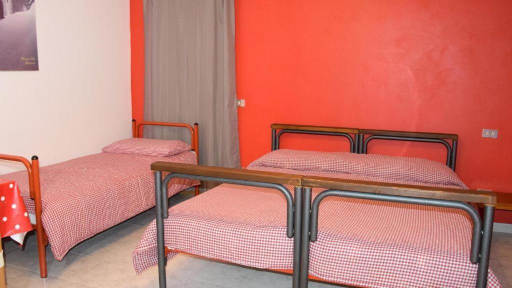 A bed or beds in a room at RIPARRUCCI nel Res Praetorium Maiella Park