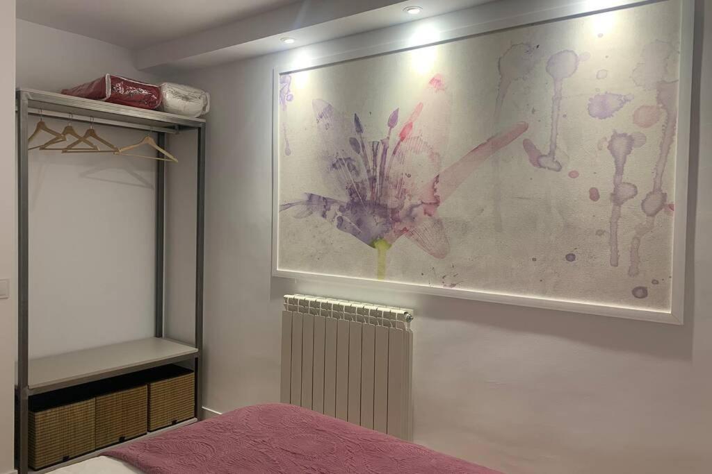 Postel nebo postele na pokoji v ubytování VUT La Casa de las Flores