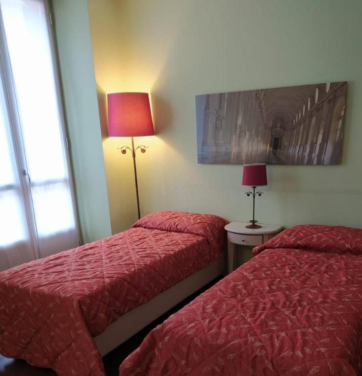 Postel nebo postele na pokoji v ubytování Santa Giulia Hotel e Residence Torino
