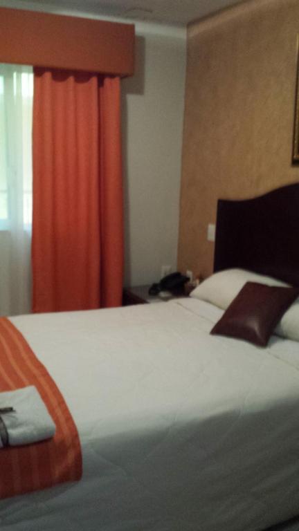 Postel nebo postele na pokoji v ubytování Hotel Anber