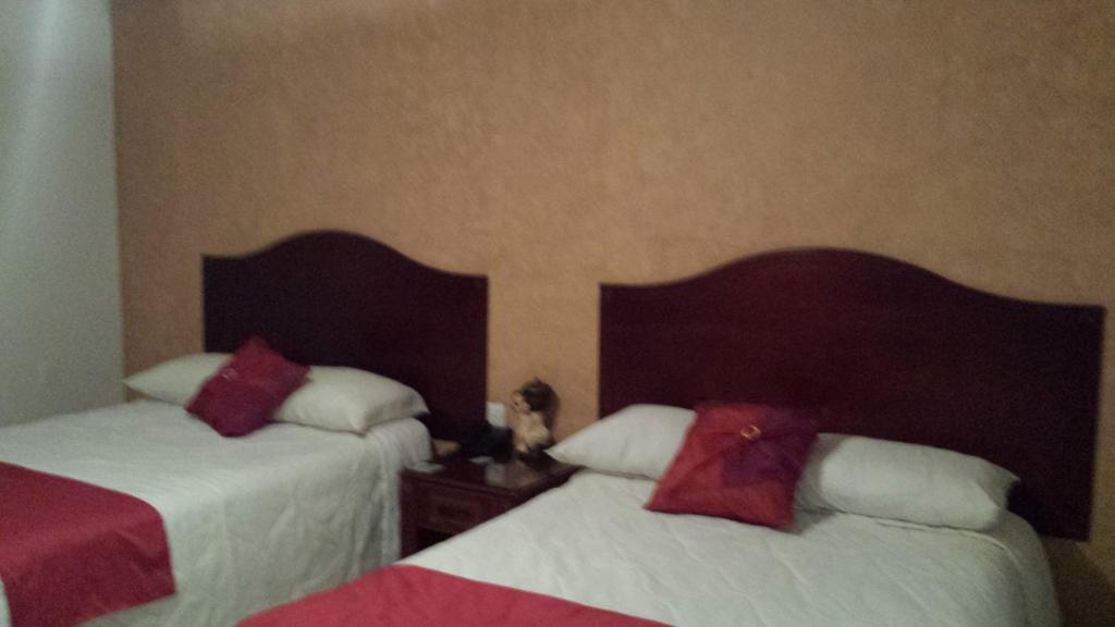 Postel nebo postele na pokoji v ubytování Hotel Anber