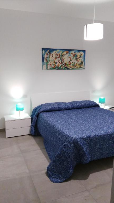 Postel nebo postele na pokoji v ubytování Via della Salvia
