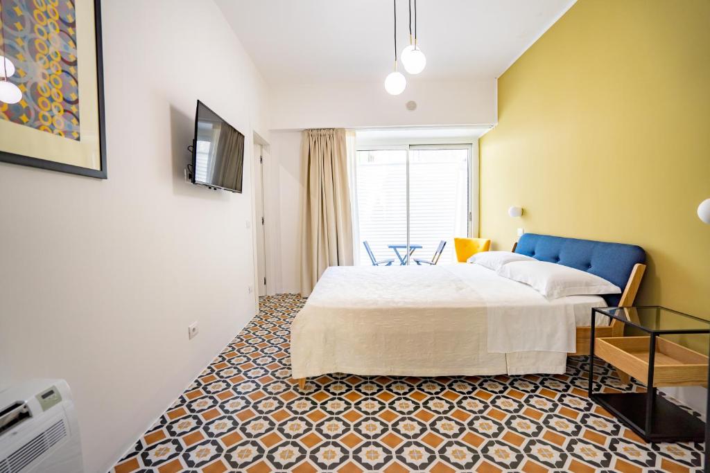 Łóżko lub łóżka w pokoju w obiekcie Borgo dei Saraceni - Flower Home