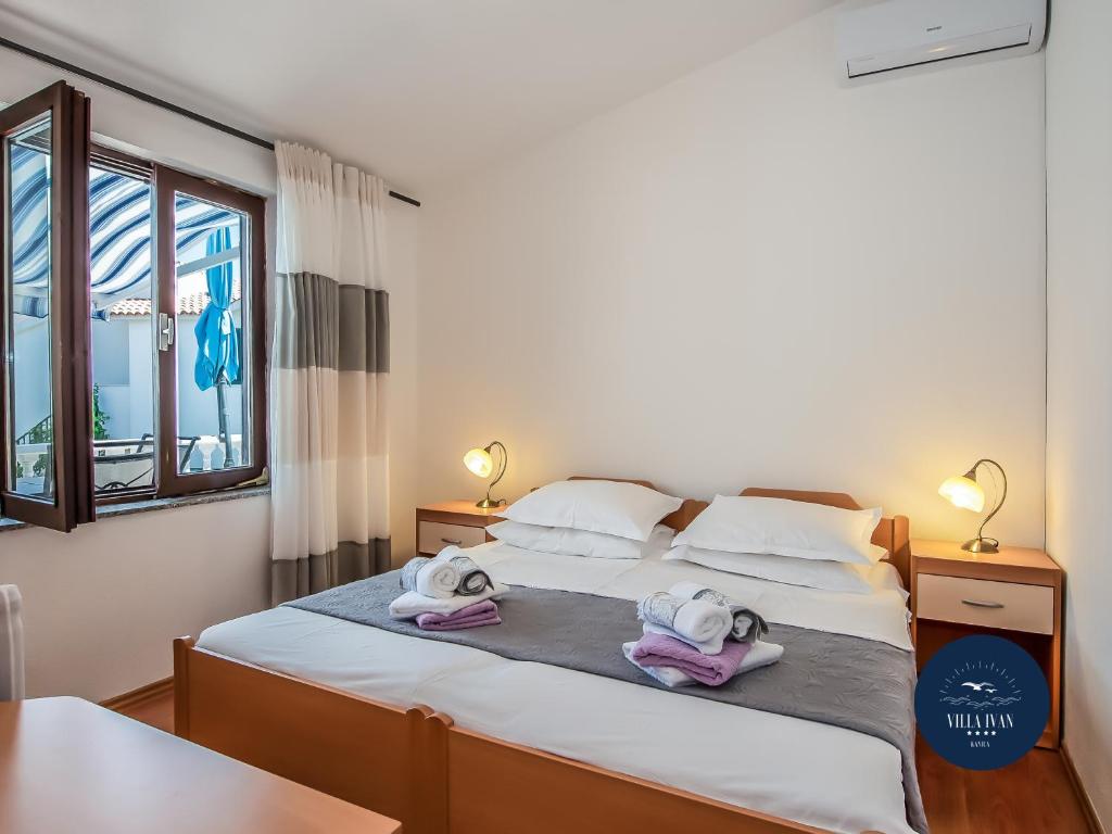 Postel nebo postele na pokoji v ubytování Villa Ivan