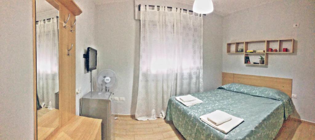 Postel nebo postele na pokoji v ubytování Arianiti Guesthouse