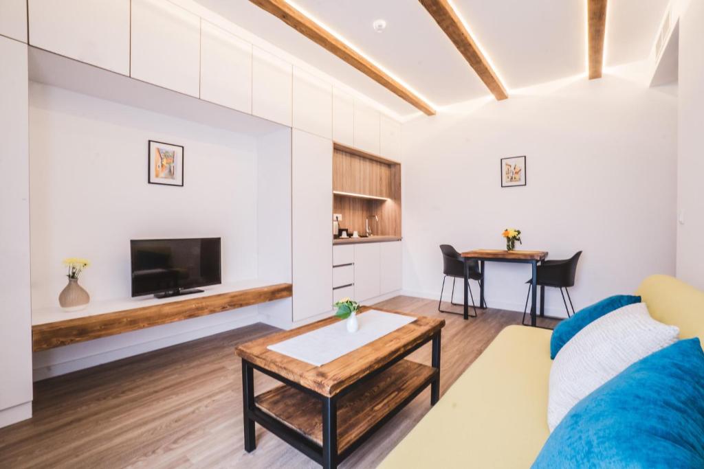 a living room with a couch and a table at Mathias Rex in Szentendre