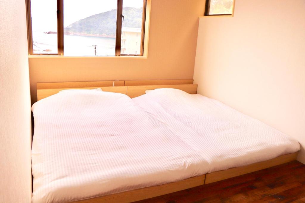Postel nebo postele na pokoji v ubytování Guesthouse All you need - All rooms have an ocean view!