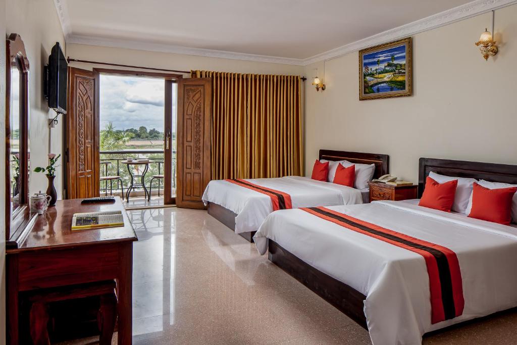Postel nebo postele na pokoji v ubytování Angkor Mithona Guesthouse