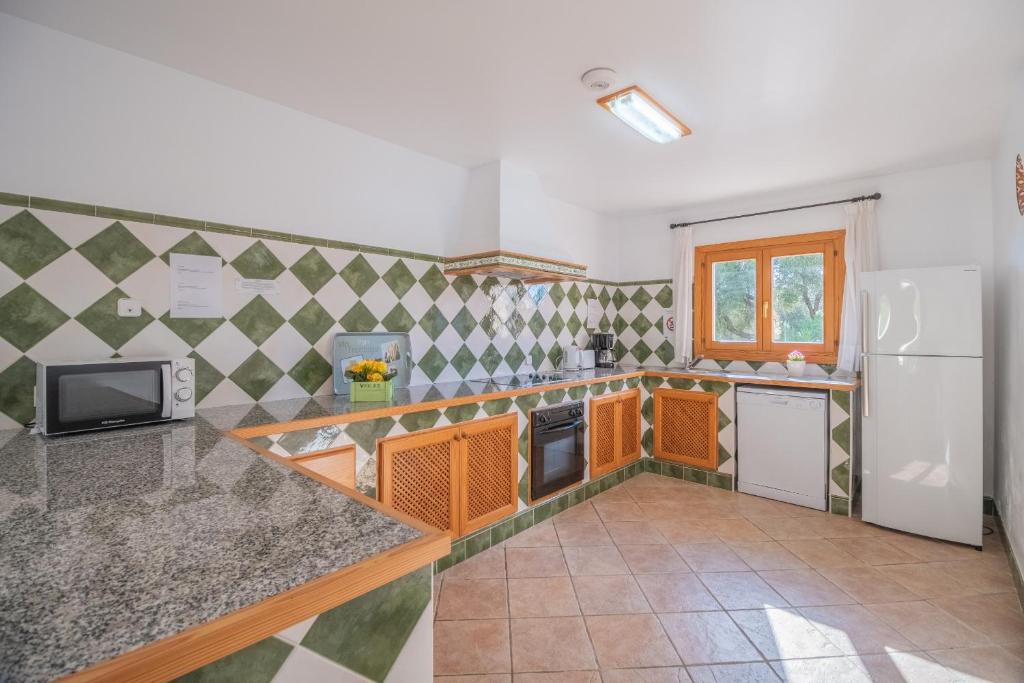 Kuchyň nebo kuchyňský kout v ubytování Finca VELA 2 by Mallorca Villa Selection