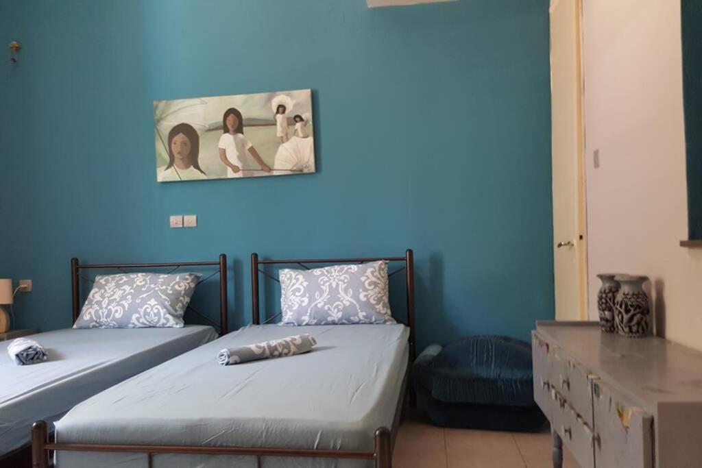 Un pat sau paturi într-o cameră la Ευρύχωρο σπίτι στην Πάτρα